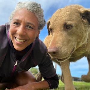 Dog sitter and dog outside taking a selfie together